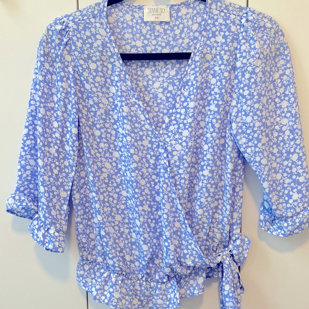 Blue and white floral wrap blouse